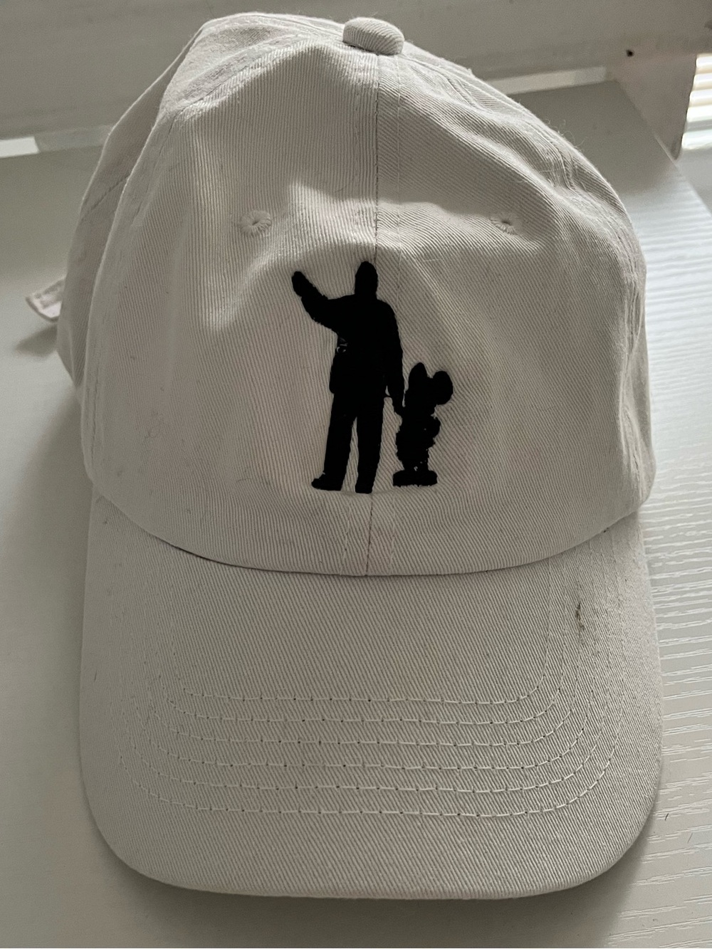 White Cap with Disney Partner Statue Silhouette Embroidery